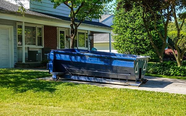 residential dumpsters can be placed on a driveway or yard, but safety measures should be required to avoid damage to the property